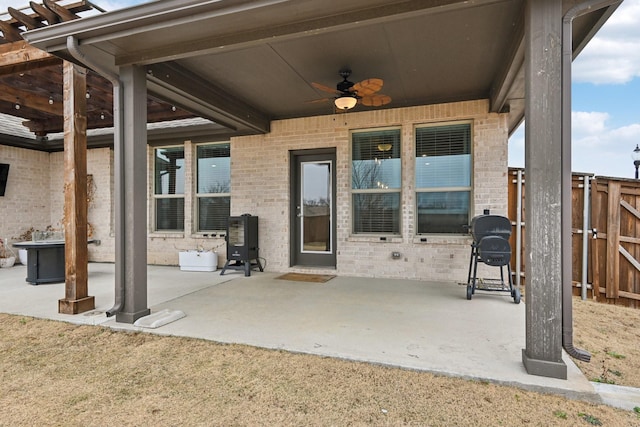 view of patio / terrace featuring a grill and ceiling fan