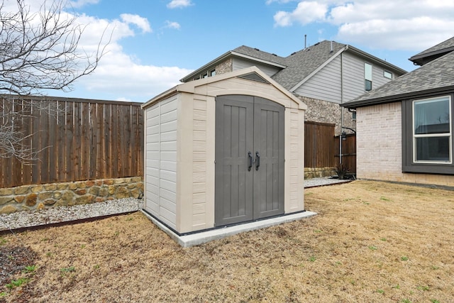 view of outdoor structure with a lawn