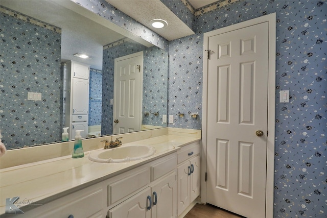 bathroom featuring vanity and a textured ceiling