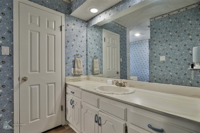 bathroom featuring vanity and wood-type flooring