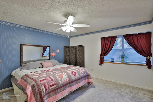 bedroom with crown molding, light carpet, a textured ceiling, and ceiling fan