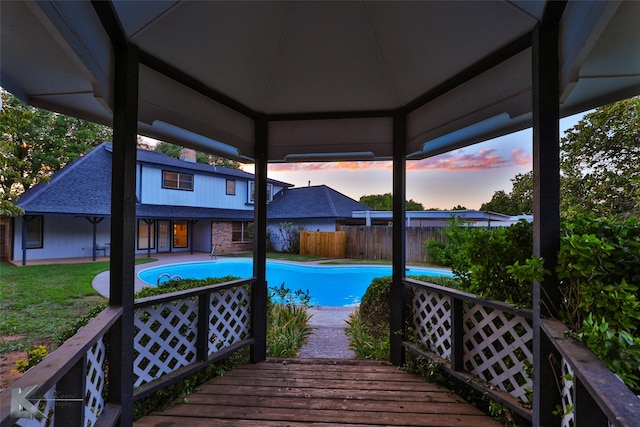 exterior space featuring a fenced in pool