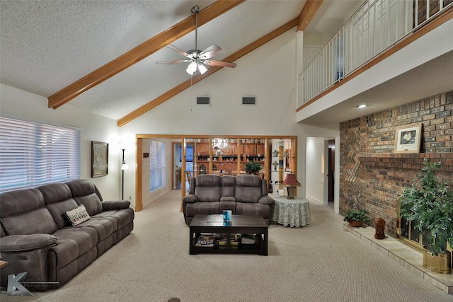 living room with high vaulted ceiling, light carpet, a textured ceiling, ceiling fan, and beam ceiling