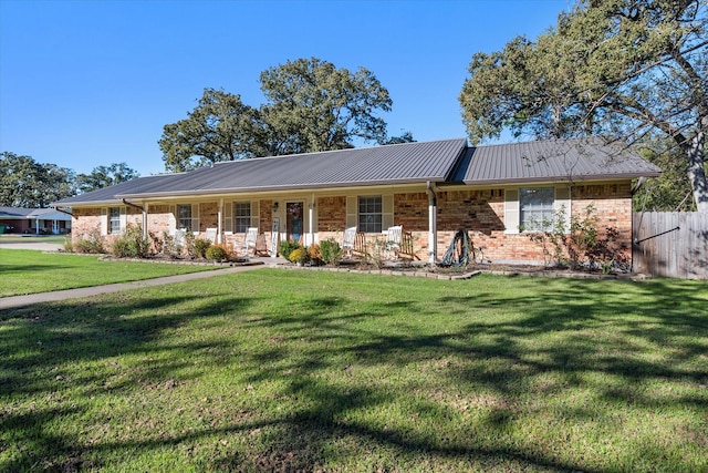 single story home featuring a front yard and covered porch