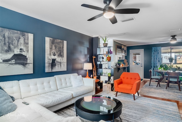 living room with hardwood / wood-style floors and ceiling fan