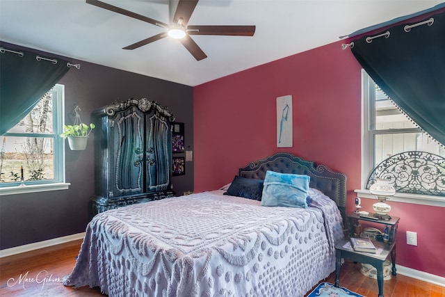 bedroom featuring wood-type flooring and ceiling fan