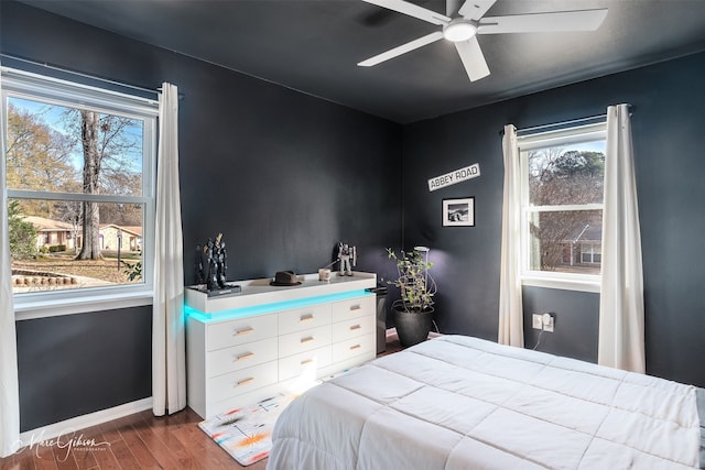 bedroom with wood-type flooring and ceiling fan