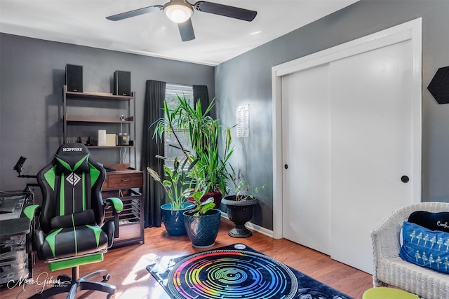 office area with ceiling fan and wood-type flooring