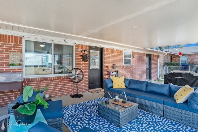 view of patio with area for grilling and outdoor lounge area