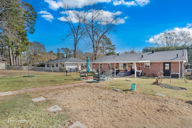 rear view of house featuring cooling unit, a yard, outdoor lounge area, and a patio