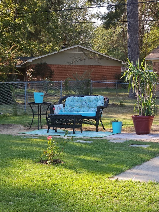 exterior space featuring outdoor lounge area and a yard