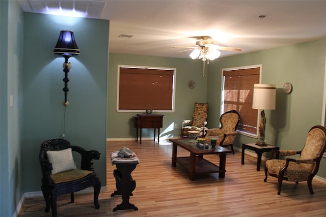 sitting room featuring ceiling fan and light hardwood / wood-style flooring