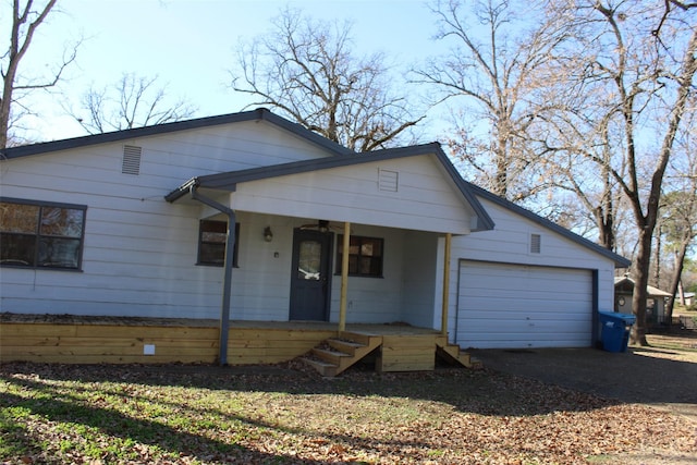 view of front of house with a porch and a garage