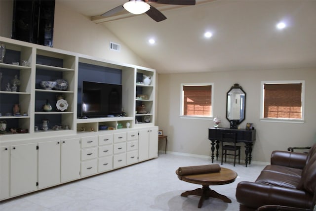 living room featuring ceiling fan and lofted ceiling