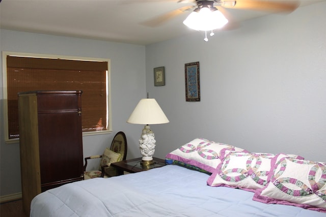 bedroom featuring ceiling fan and a closet