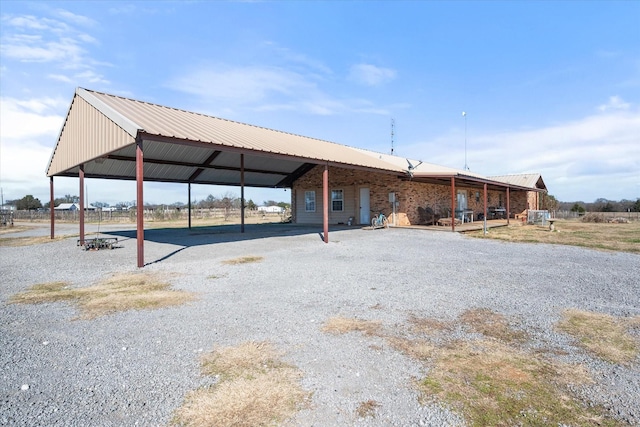 rear view of property with a carport