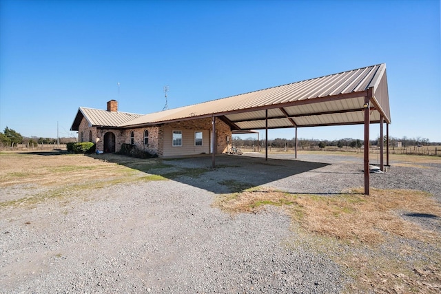 exterior space with a carport