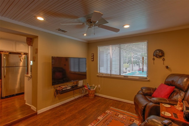 living room with crown molding, wood-type flooring, and ceiling fan