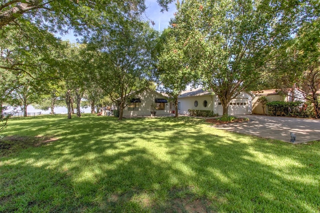 view of yard featuring a garage