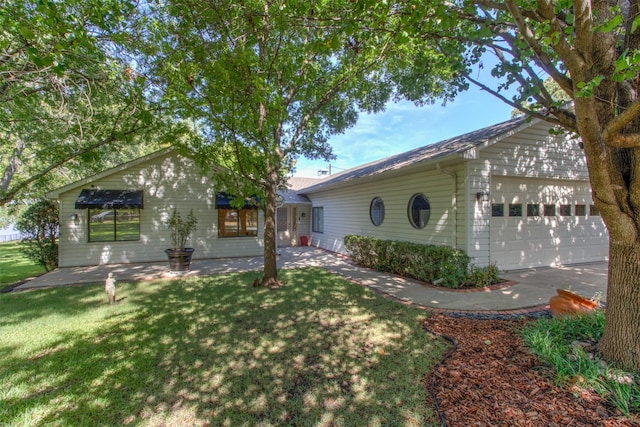 exterior space with a garage and a front yard