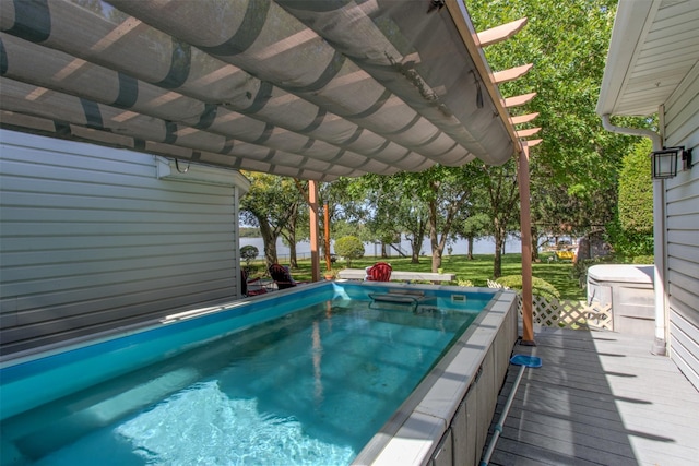 view of pool featuring a deck and a pergola