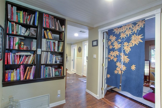 corridor with crown molding and dark hardwood / wood-style floors