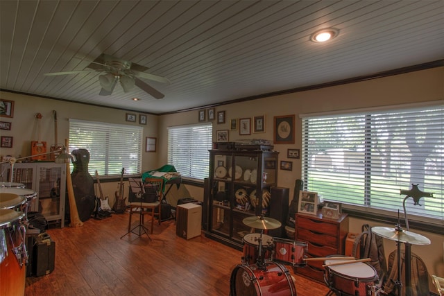 interior space with wood ceiling, a wealth of natural light, ornamental molding, and hardwood / wood-style flooring