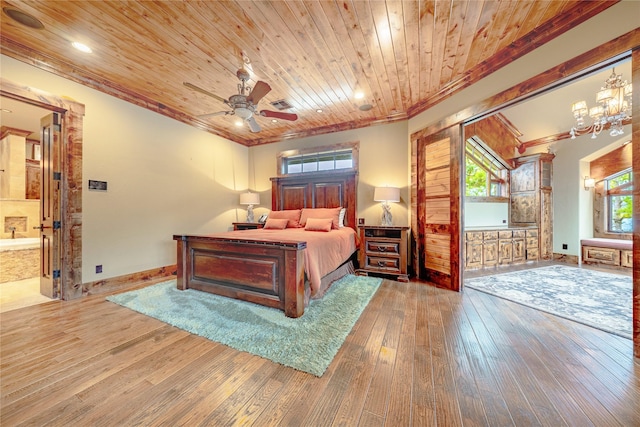 bedroom with hardwood / wood-style floors, ceiling fan with notable chandelier, ensuite bath, and wooden ceiling