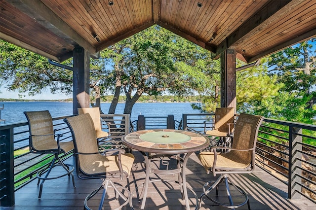 wooden deck with a water view