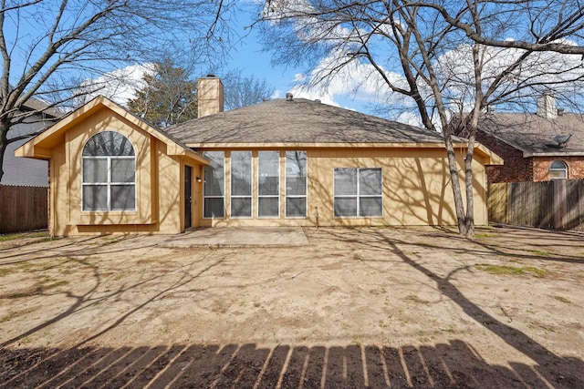 back of house with a patio area