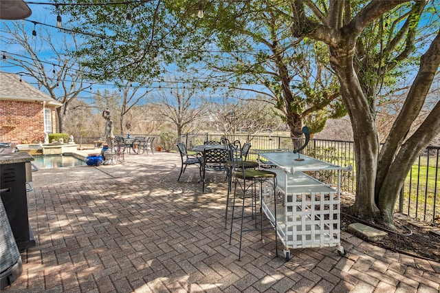 view of patio / terrace featuring a fenced in pool