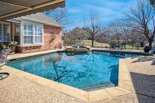 view of swimming pool featuring an in ground hot tub