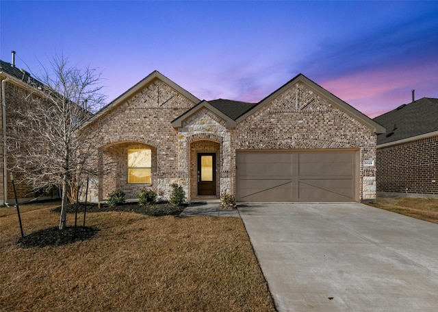 french country home with a garage