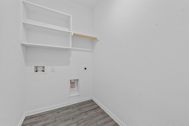 washroom featuring washer hookup, dark hardwood / wood-style flooring, and electric dryer hookup