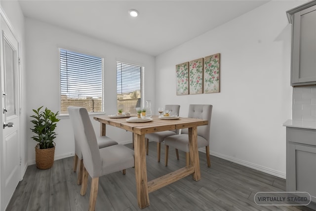 dining area with dark wood-type flooring