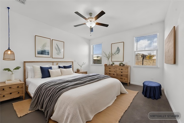 bedroom with multiple windows and ceiling fan