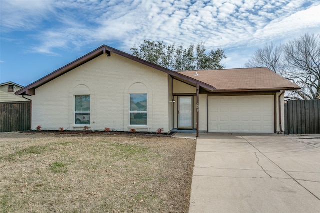 single story home with a garage and a front yard