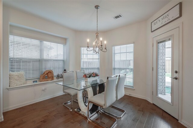 509 Christie Xing, Celina, TX 75009 - dining room featuring an inviting chandelier, a healthy amount of sunlight, and dark hardwood / wood-style floors