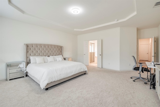 509 Christie Xing, Celina, TX 75009 - carpeted bedroom featuring connected bathroom and a tray ceiling