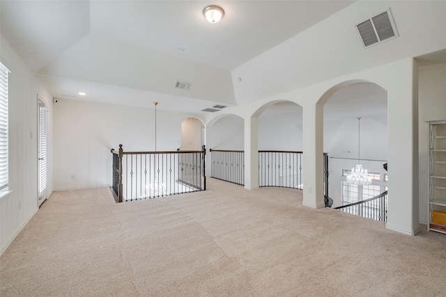 509 Christie Xing, Celina, TX 75009 - unfurnished room featuring vaulted ceiling, light carpet, and an inviting chandelier