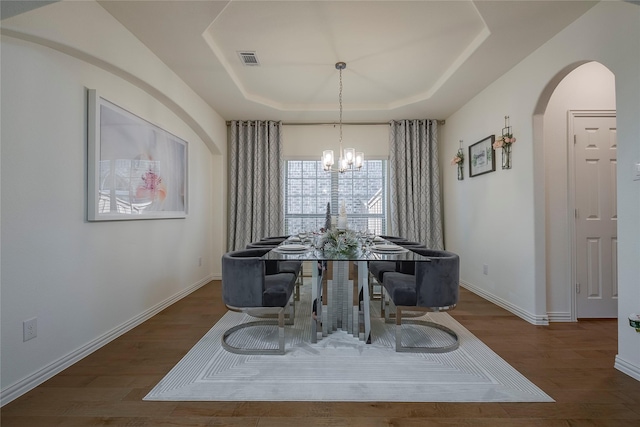 509 Christie Xing, Celina, TX 75009 - dining space with a chandelier, dark hardwood / wood-style floors, and a raised ceiling