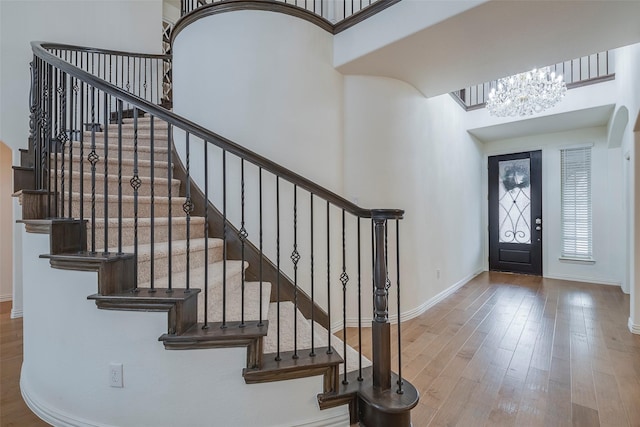 509 Christie Xing, Celina, TX 75009 - foyer entrance with a high ceiling, wood-type flooring, and a chandelier