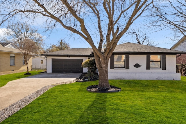 ranch-style home with a garage and a front lawn