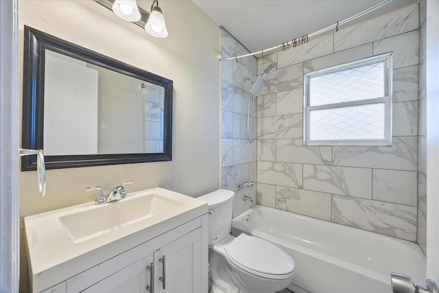 full bathroom with vanity, toilet, and tiled shower / bath