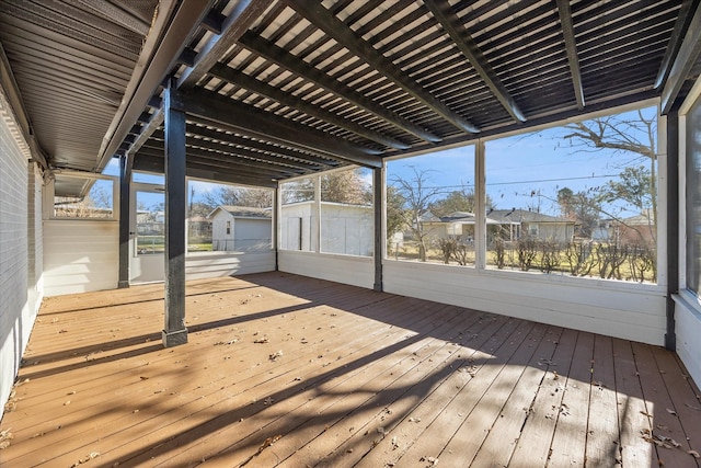 deck featuring a storage shed and a pergola