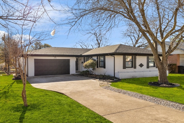 ranch-style house with a garage and a front yard