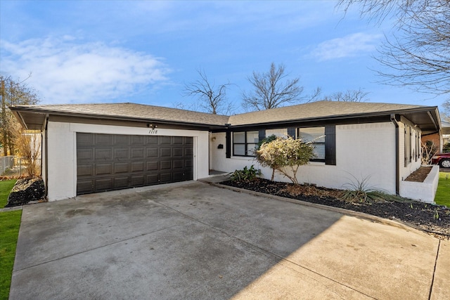 ranch-style house featuring a garage