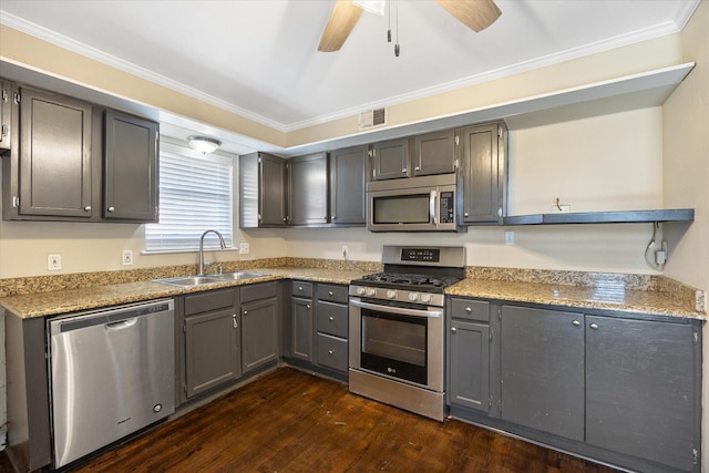 kitchen with gray cabinets, dark hardwood / wood-style floors, sink, stainless steel appliances, and crown molding