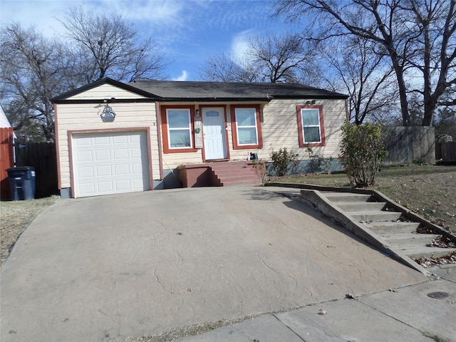 ranch-style house featuring a garage