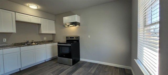 kitchen featuring sink, dark stone countertops, white cabinets, dark hardwood / wood-style flooring, and stainless steel electric stove